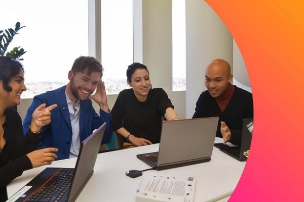 Colleagues having a meeting in an office space.